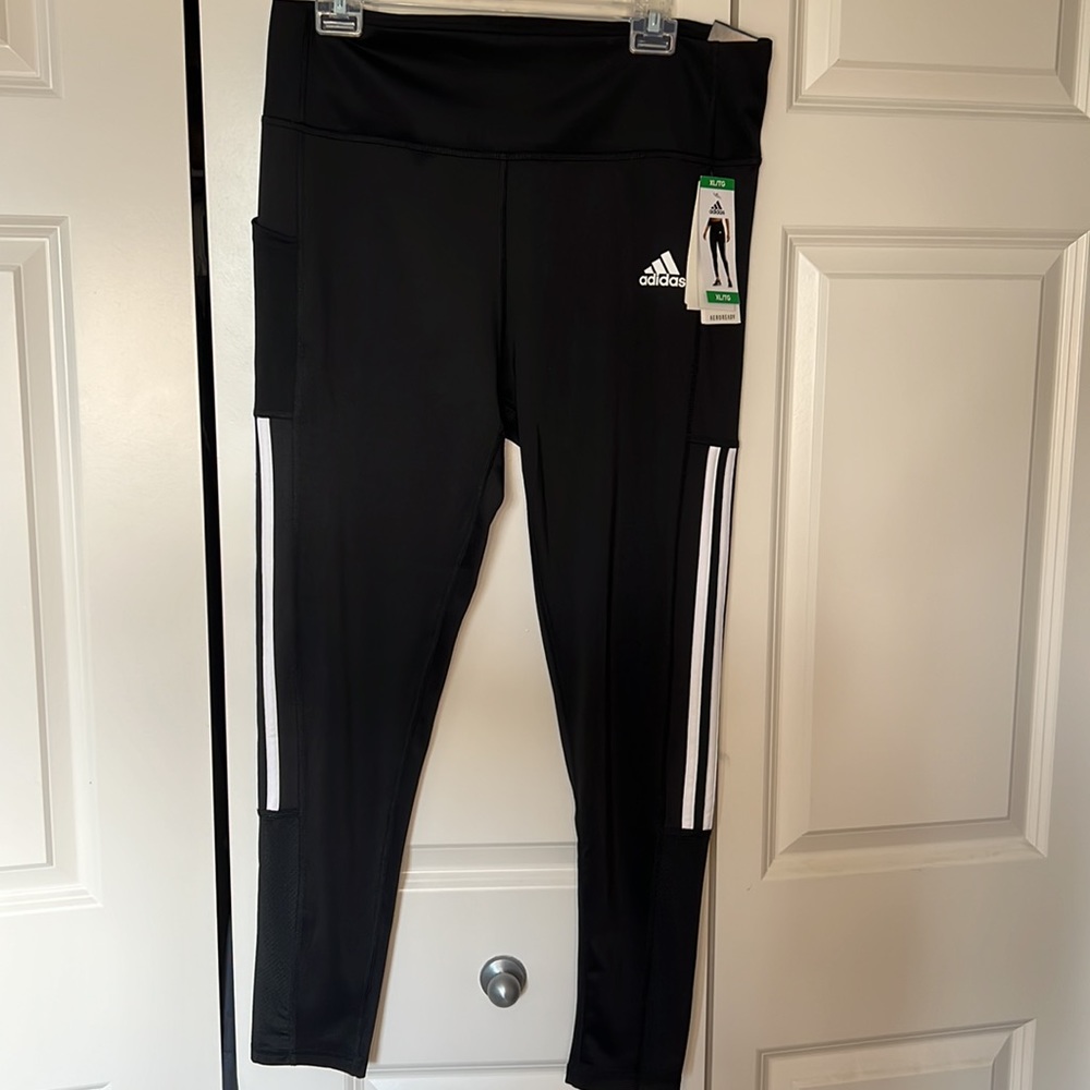 Black w/white striped on side adidas leggings.